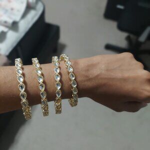 Gold and crystal/stone bangles